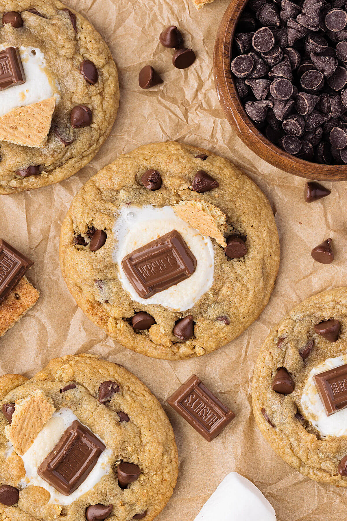 Sourdough s'mores cookies on a piece of parchment paper after baking.