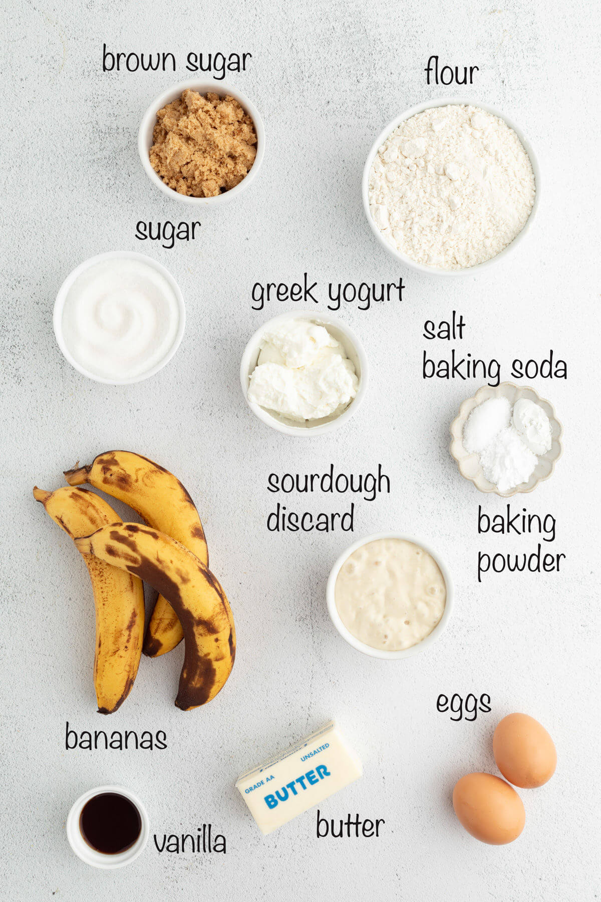 Sourdough banana bread recipe ingredients in small bowls.