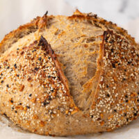 Everything Bagel sourdough bread on a cooling rack.
