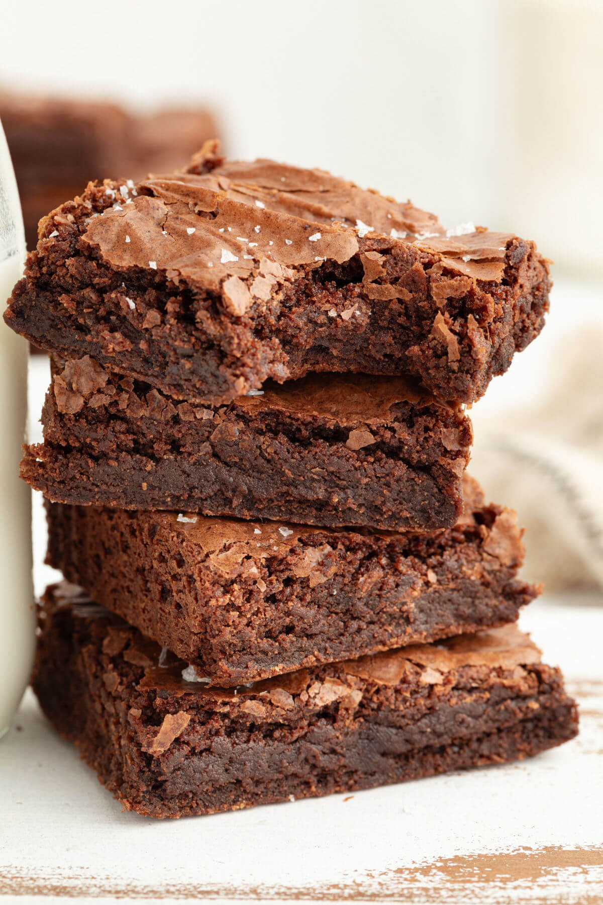 Sourdough chocolate brownies stacked on a plate.