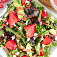 Strawberry goat cheese salad in a bowl.