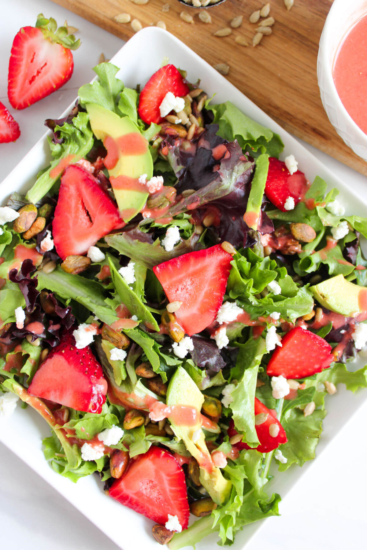 Strawberry goat cheese salad in a bowl.