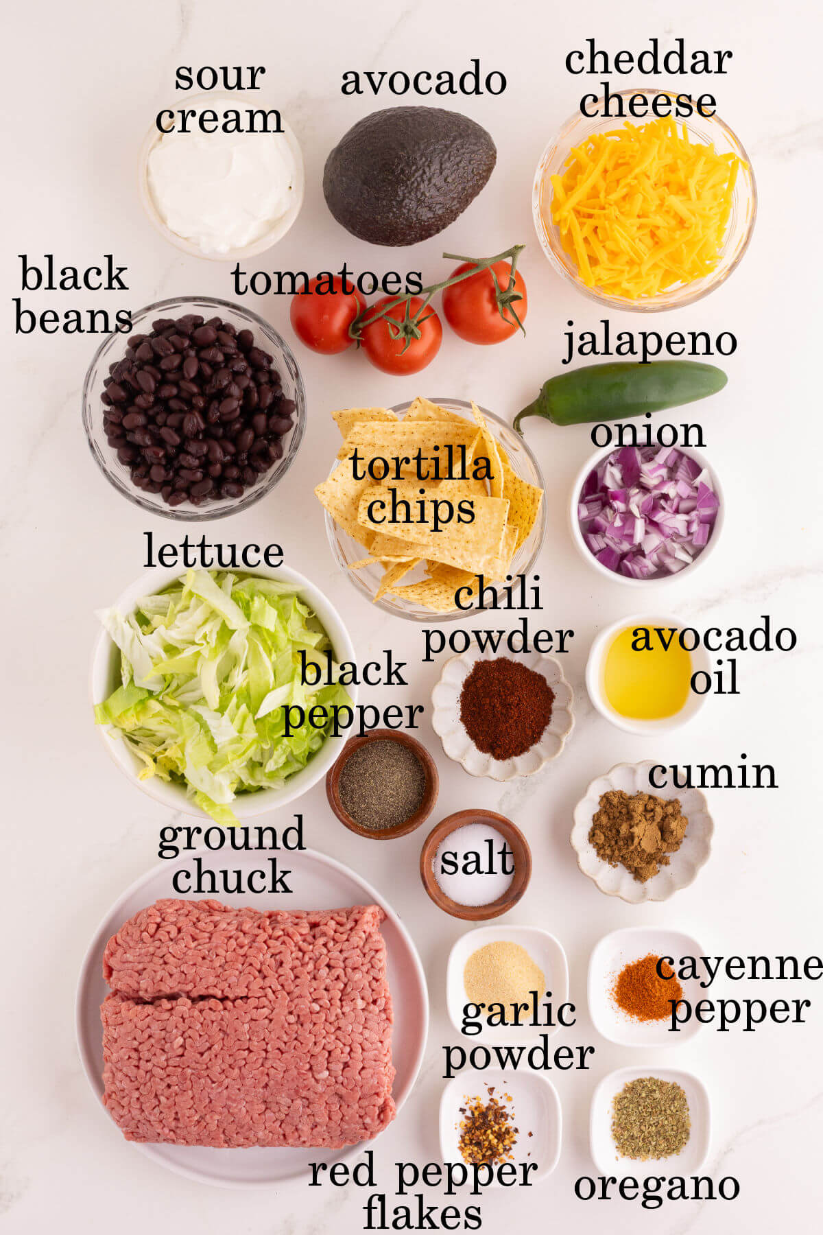 Ingredients for easy taco salad in small bowls.