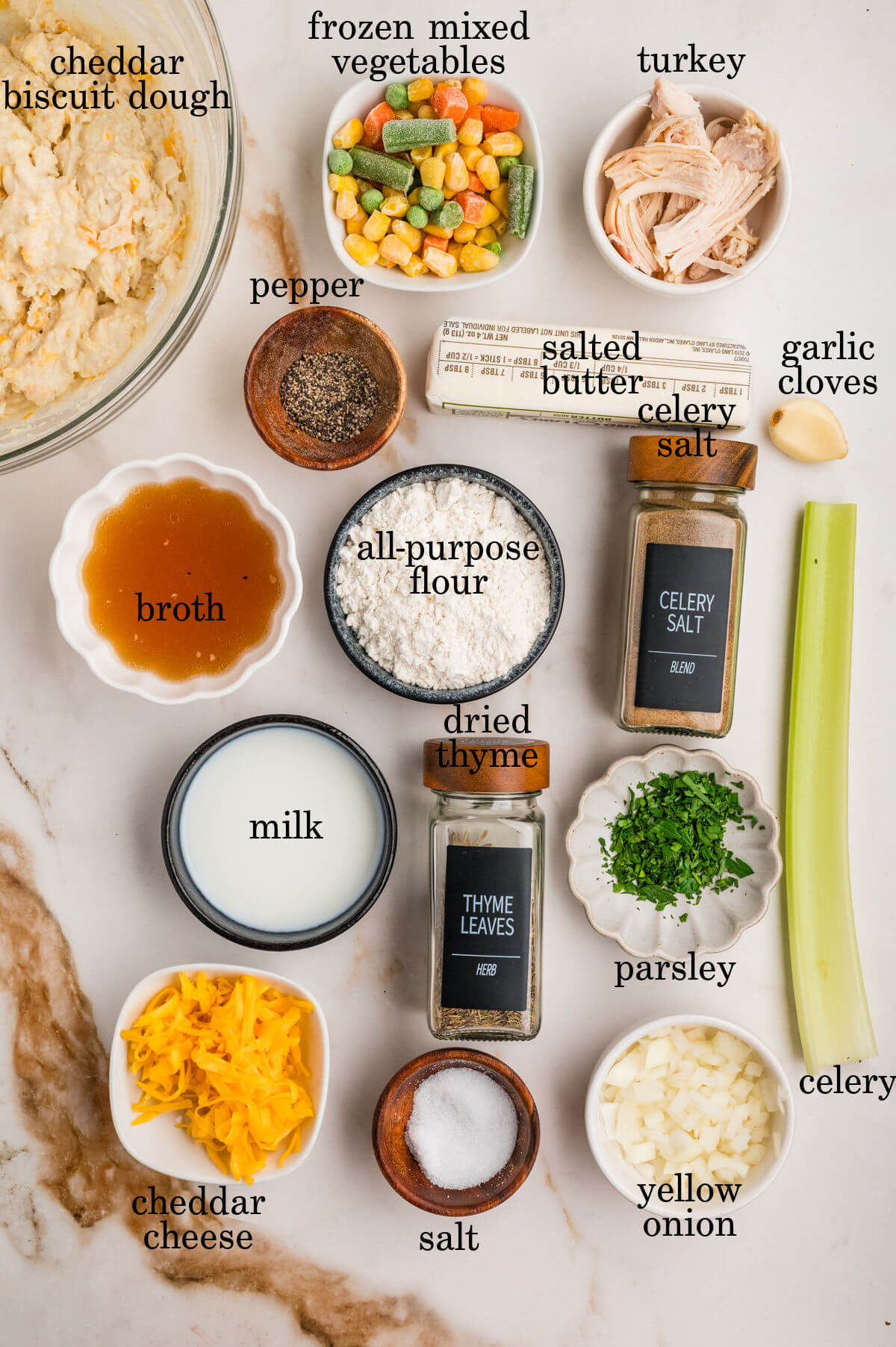 Ingredients in small bowls with text overlay labeling each ingredient.