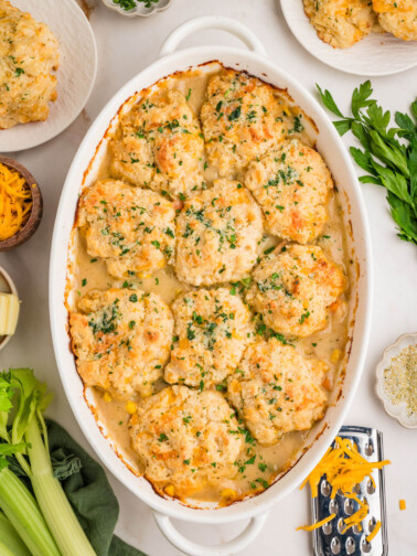 Turkey pot pie with biscuits in an oval casserole dish.