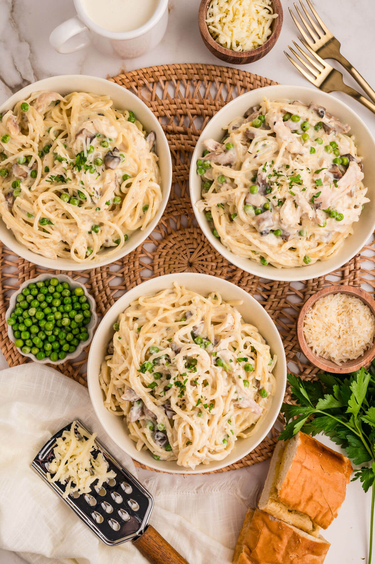 Three bowls of turkey tetrazzini.