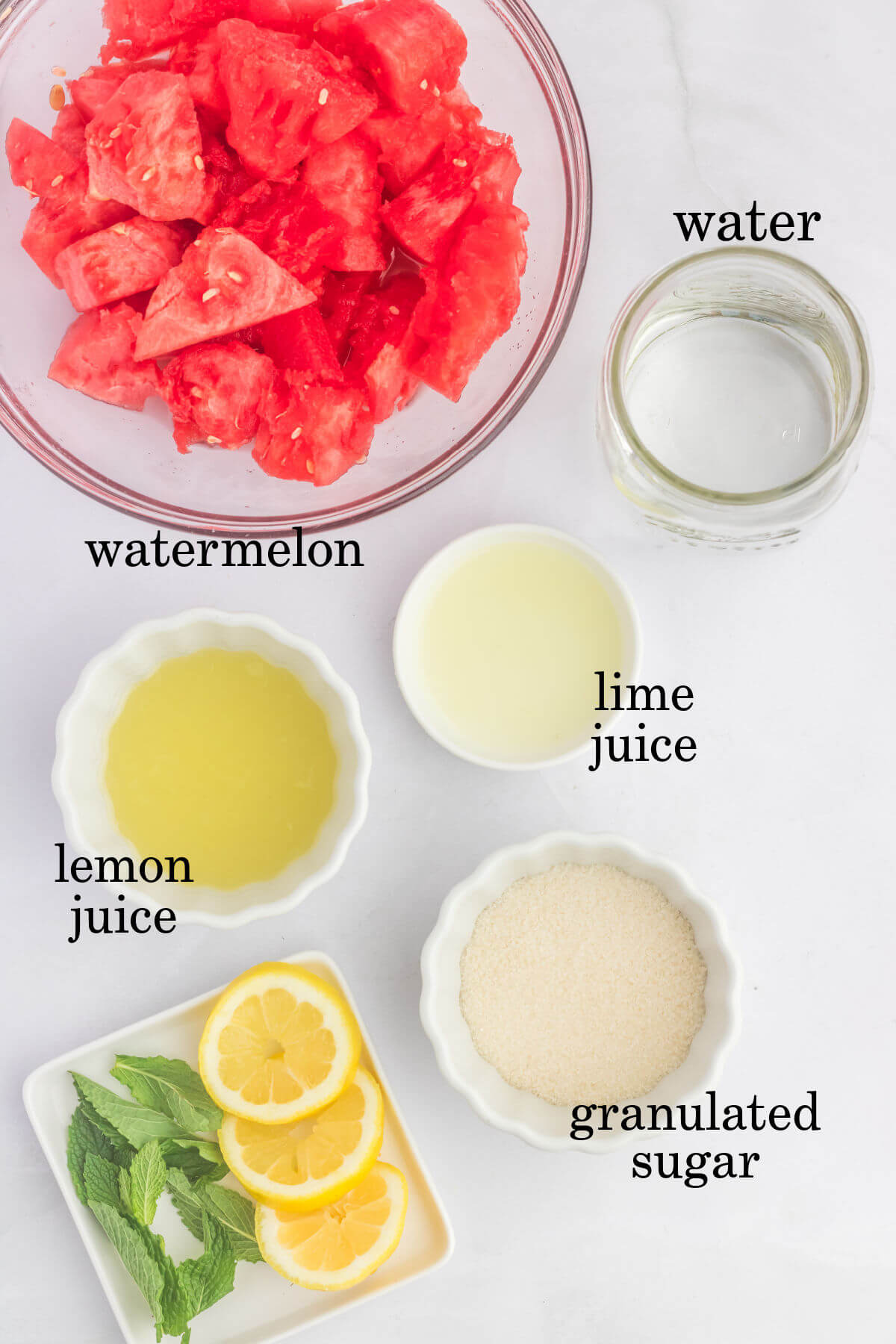 Watermelon lemonade ingredients in small bowls.