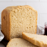 Simple bread machine white bread on a cutting board.