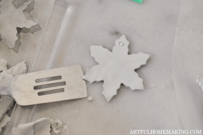 removing clay snowflake shape to dry