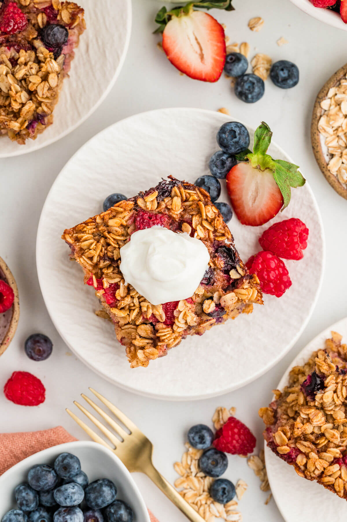 Baked oatmeal with berries on a plate.