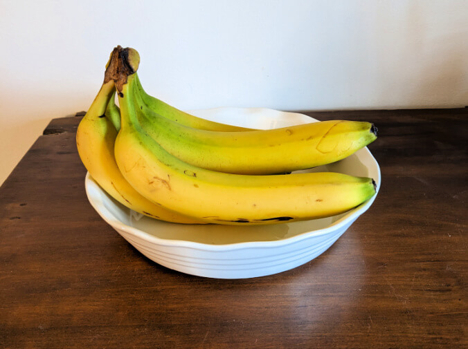 bananas in white bowl