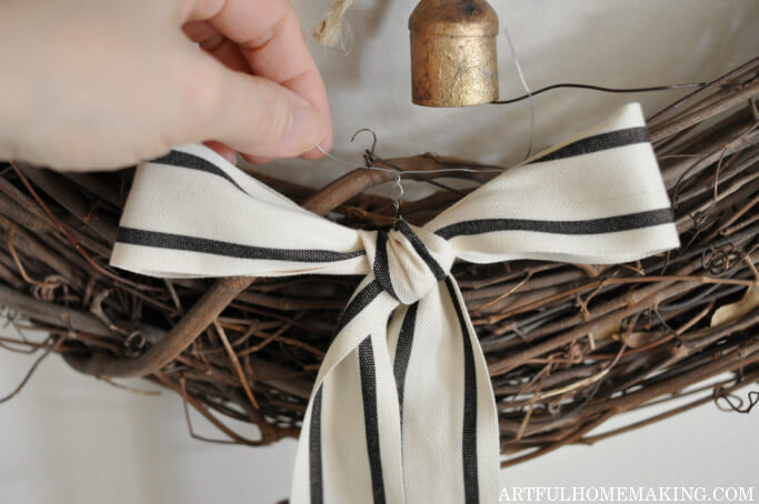 diy christmas wreath with bells and black ticking ribbon