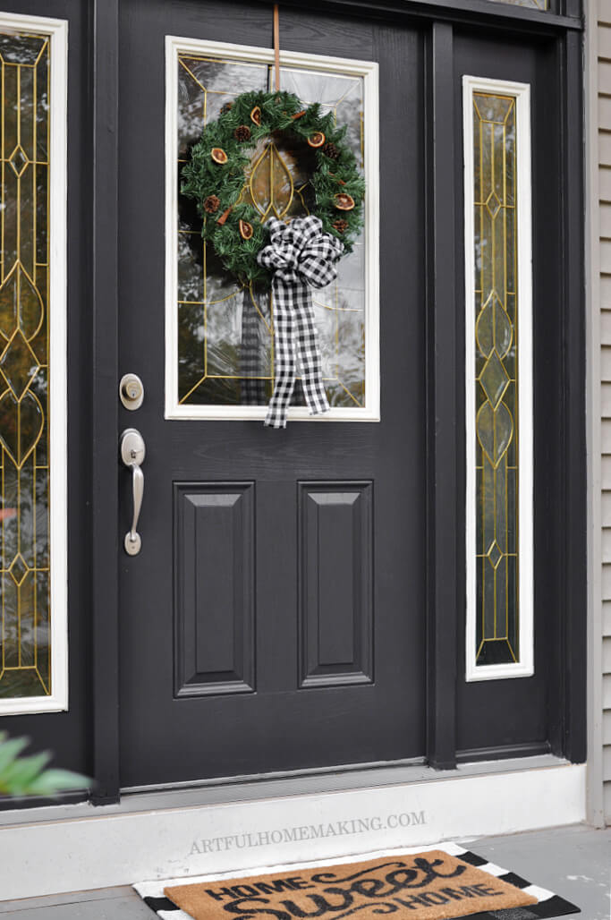 front door with buffalo check wreath