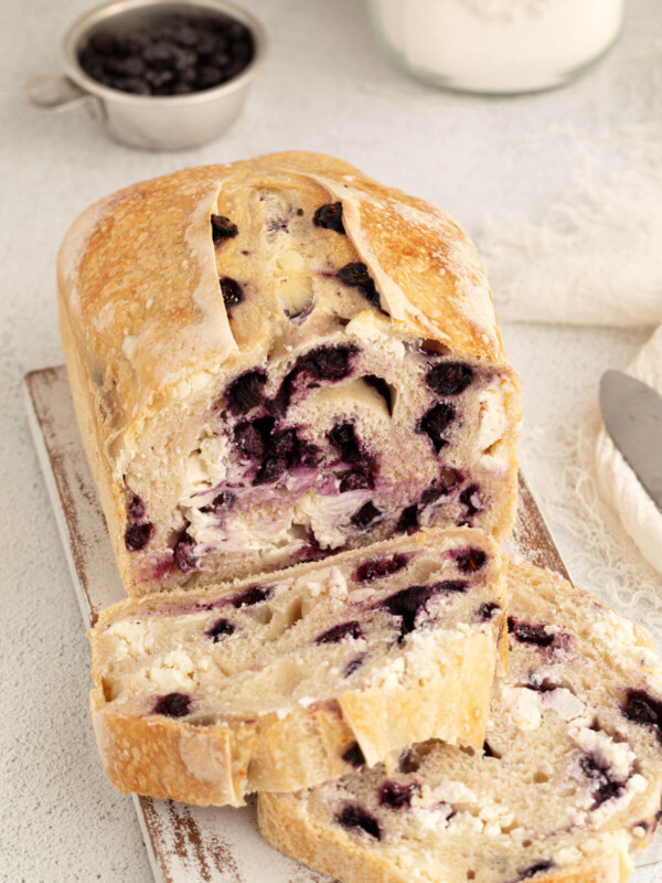 top down view of blueberry cream cheese sourdough bread loaf with two slices cut off