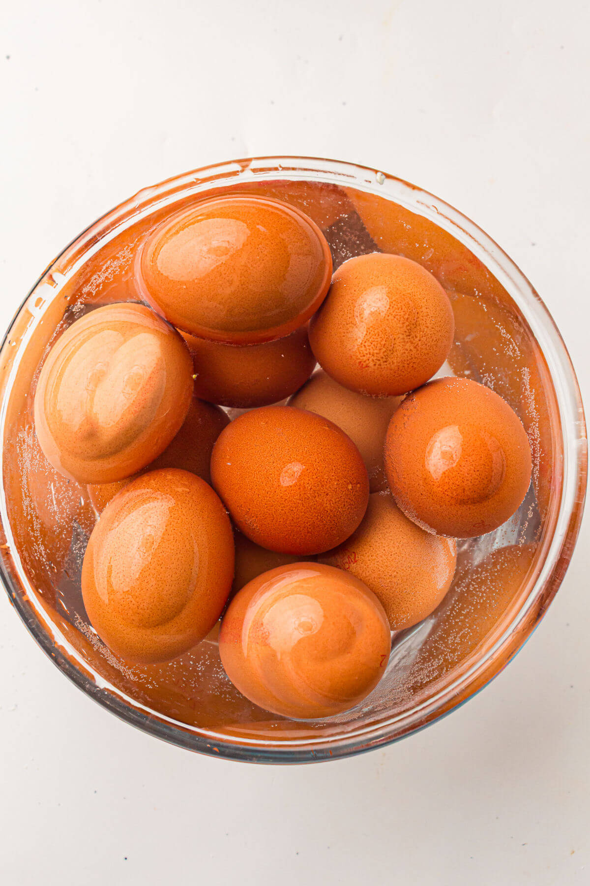 Eggs in cold water bath after hard boiling.