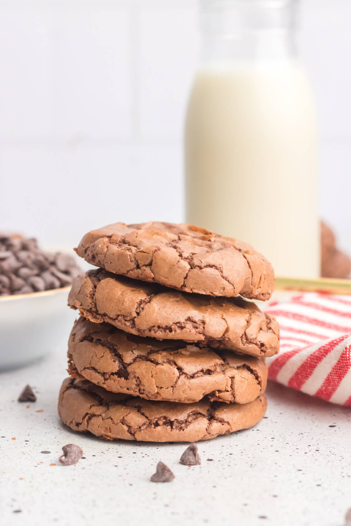 stack of four brownie cookies on a white countertop