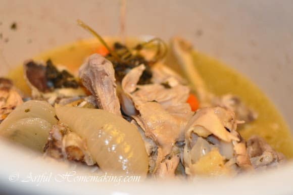 chicken bones used to make homemade stock in a slow cooker
