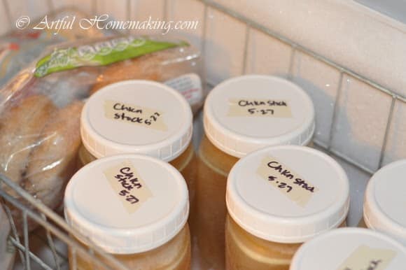 jars of homemade chicken stock stored in the freezer