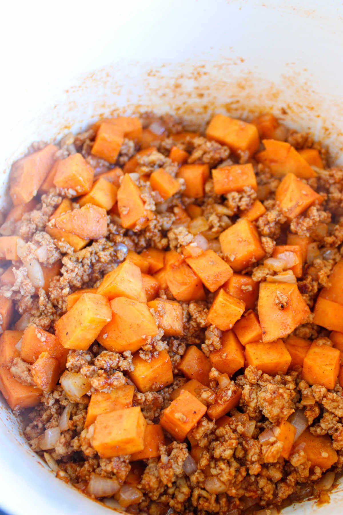 Chicken chili with sweet potatoes in a Dutch oven.