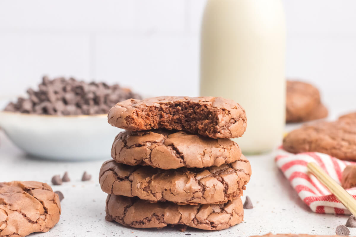 stack of brownie cookies with bite taken out of top cookie