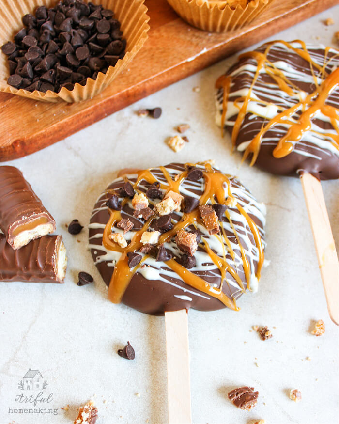 chocolate covered apple slices with candy bar next to it