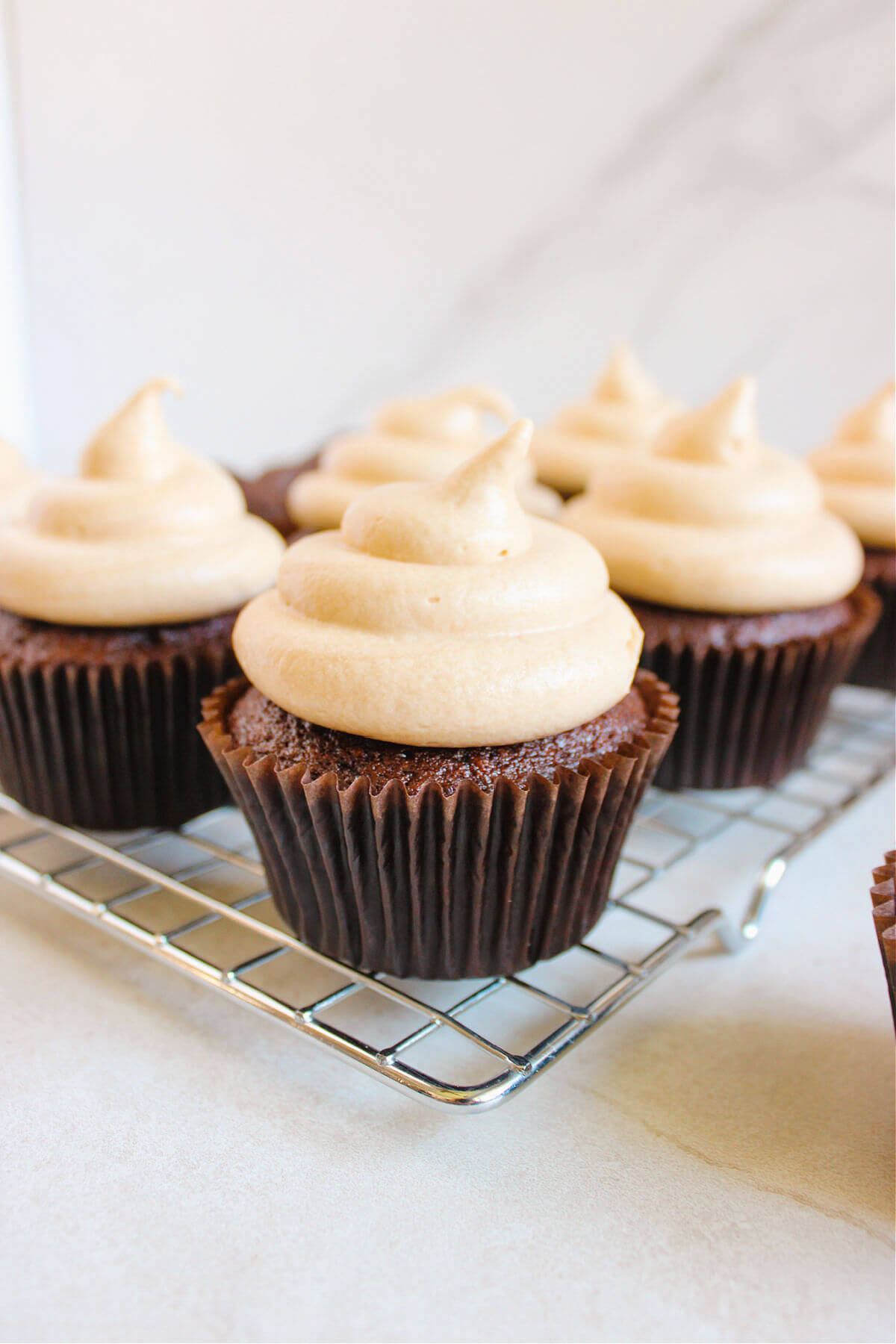chocolate coffee cupcakes on a wire cooling rack.