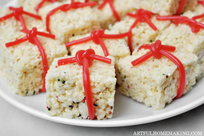 crisped rice treats with red licorice on plate