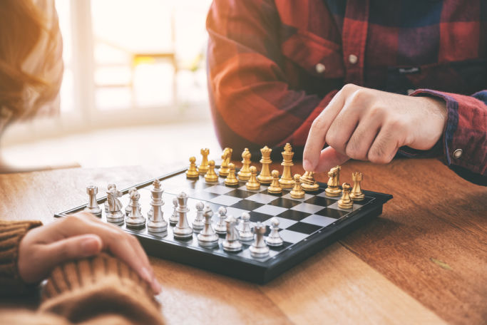 couple playing chess for game night