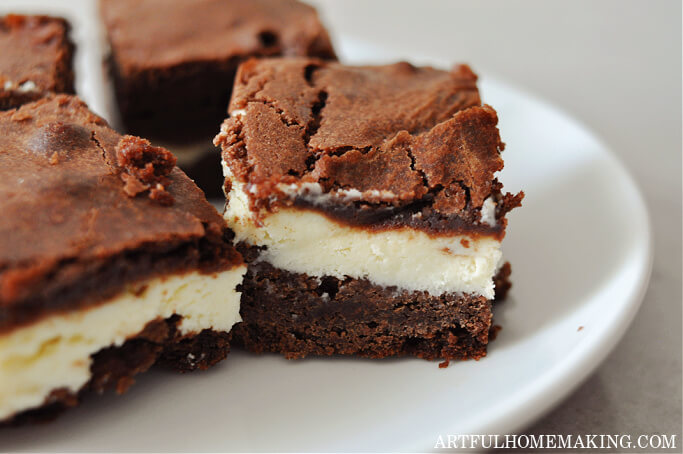 chocolate cream cheese brownies on a white plate