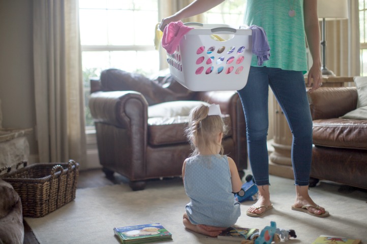 mom decluttering with child