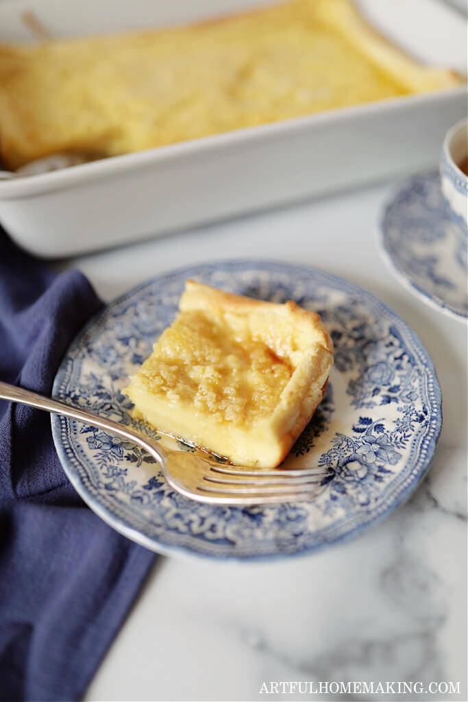 dutch baby puff pancake on a blue and white plate