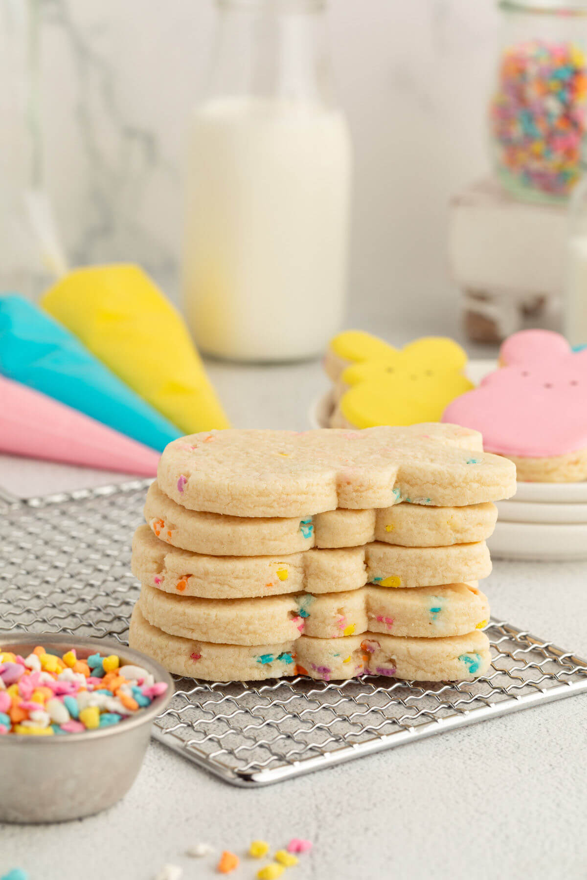 easter sugar cookies in a stack on a cooling. rack