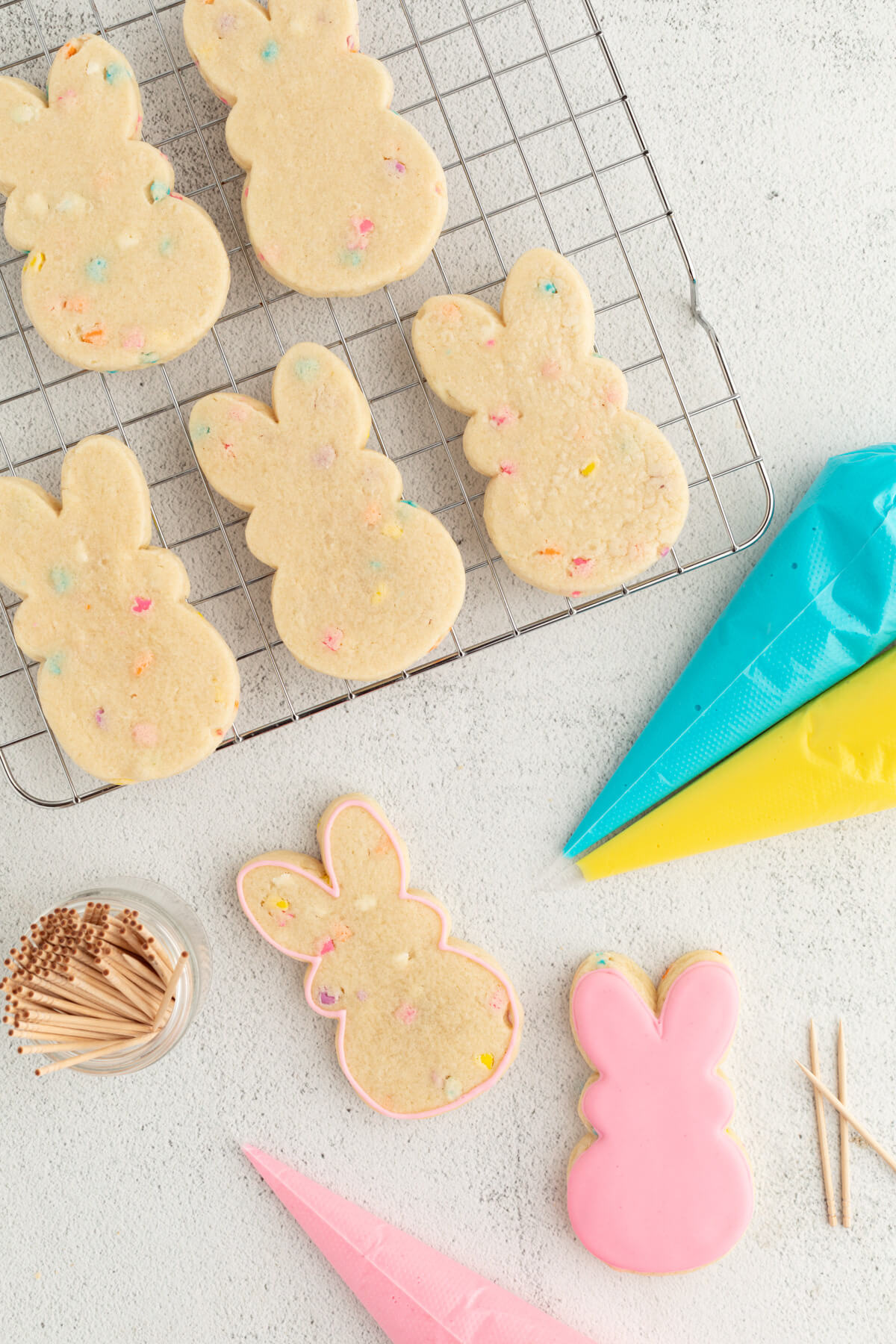 top down view showing how to ice sugar cookies with royal icing