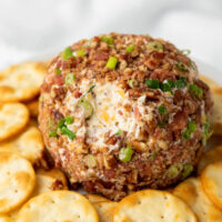 a bacon cheeseball with crackers