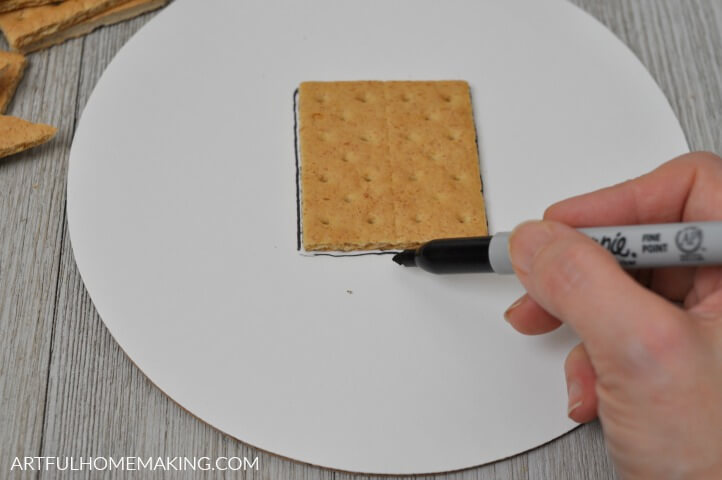 drawing around a graham cracker used to make a gingerbread house