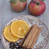 Apples, orange slices, and cinnamon sticks to make a fall simmer pot.