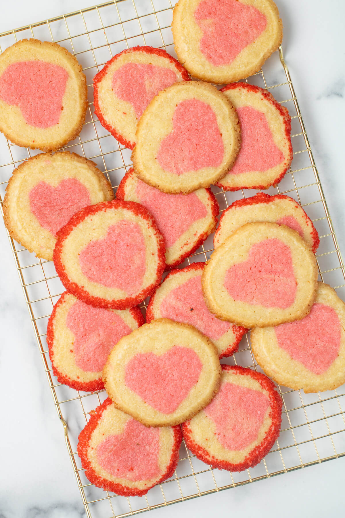 top down view of slice and bake heart cookies on a cooling rack