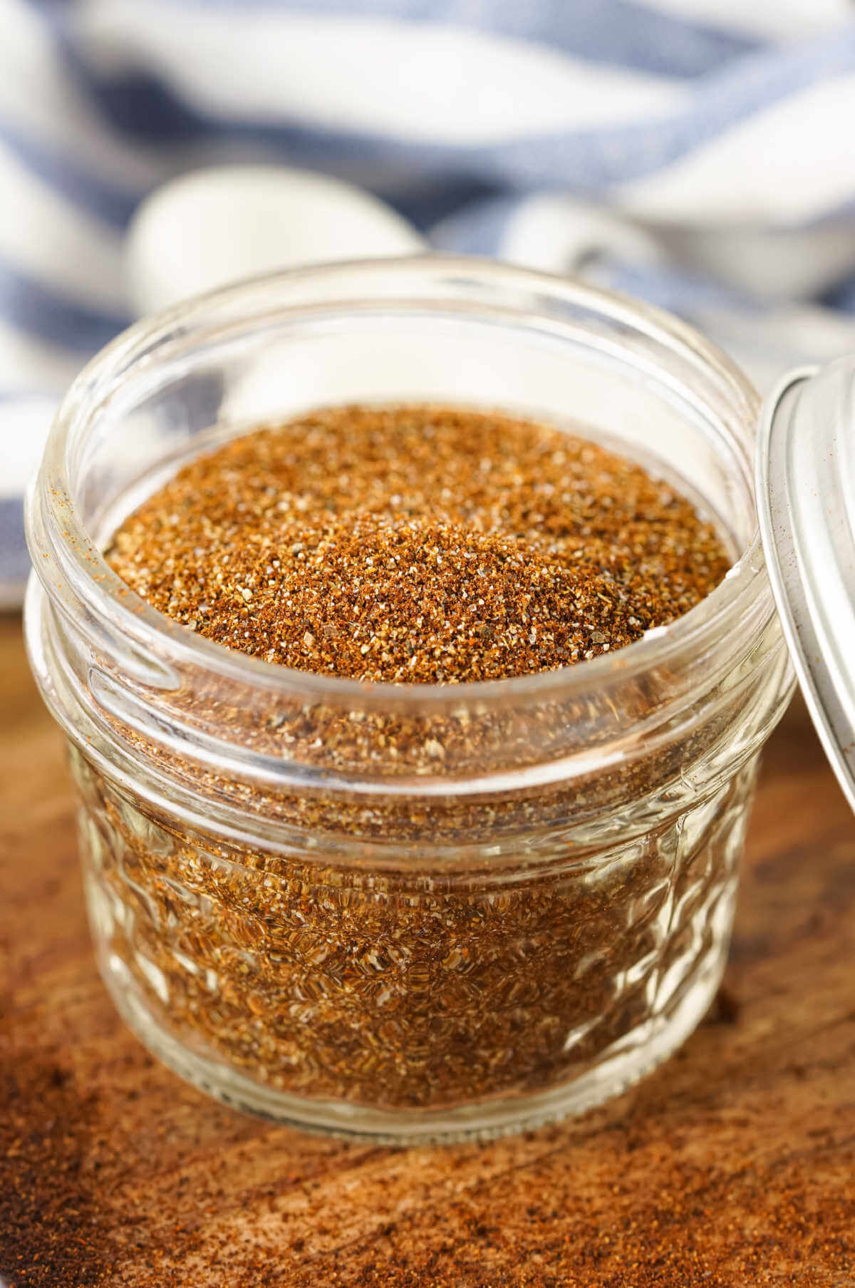 Homemade chili seasoning mix in a glass Mason jar.