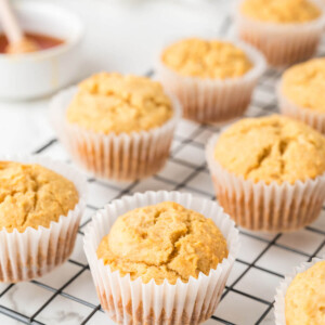 side view of cornbread muffins on a wire cooling rack