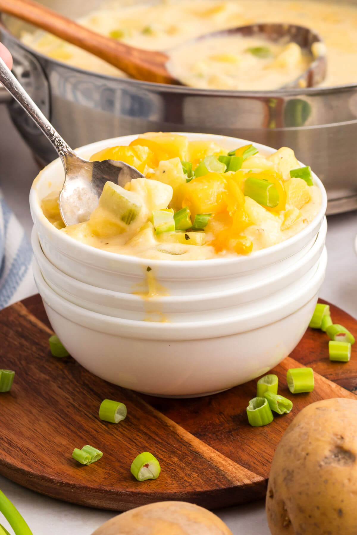 cheesy potato soup in a white bowl