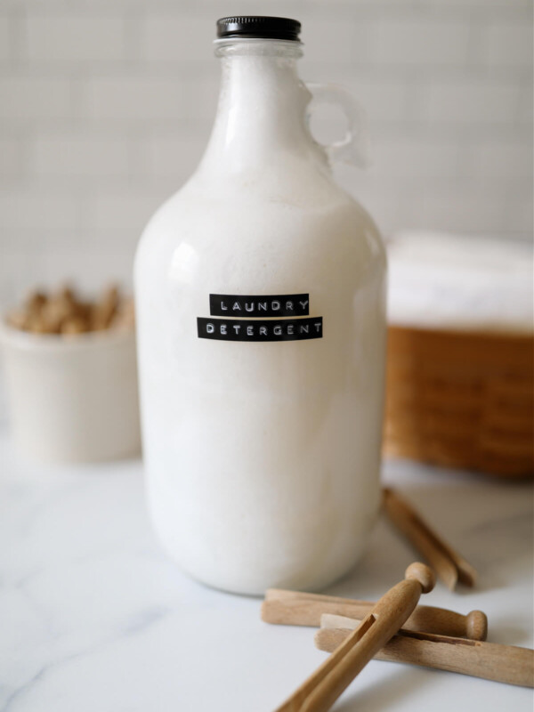 Homemade liquid laundry detergent in a half gallon glass jar.