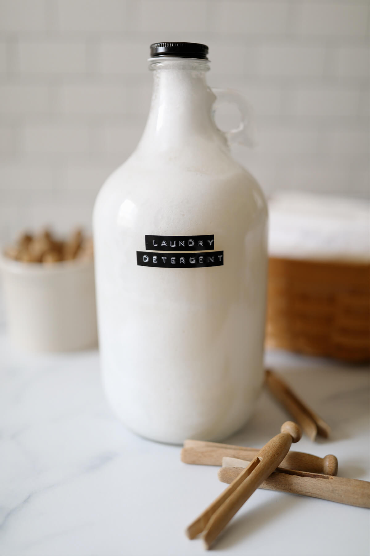 Homemade liquid laundry detergent in a half gallon glass jar.