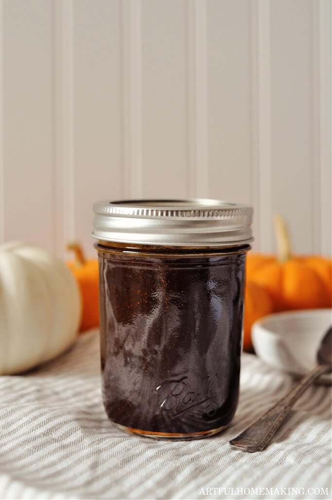pumpkin spice syrup in mason jar with pumpkins in background