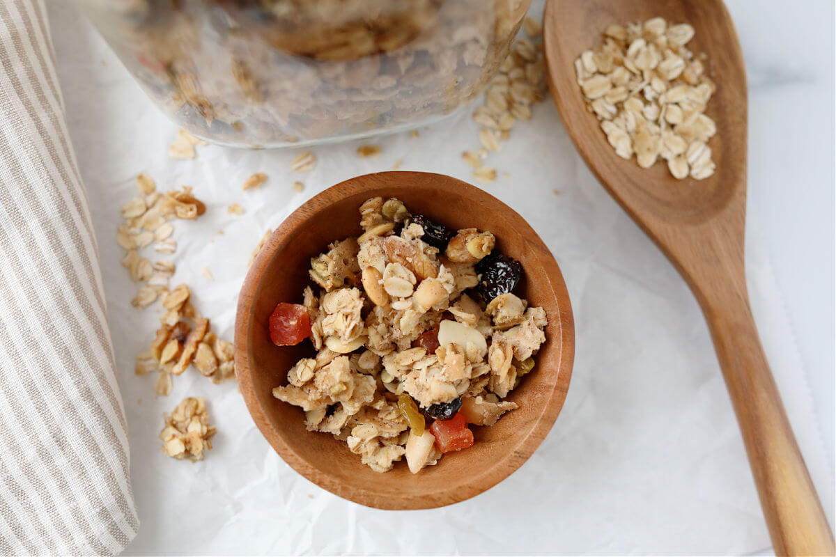 Sourdough granola in a small wooden bowl.