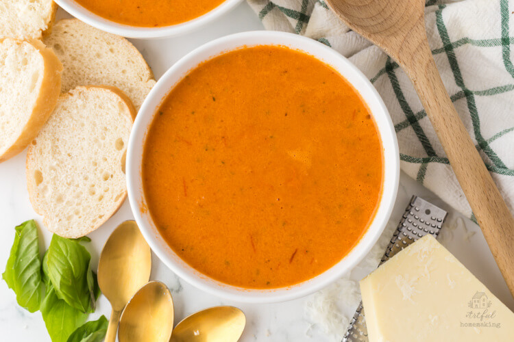white bowls with roasted tomato soup