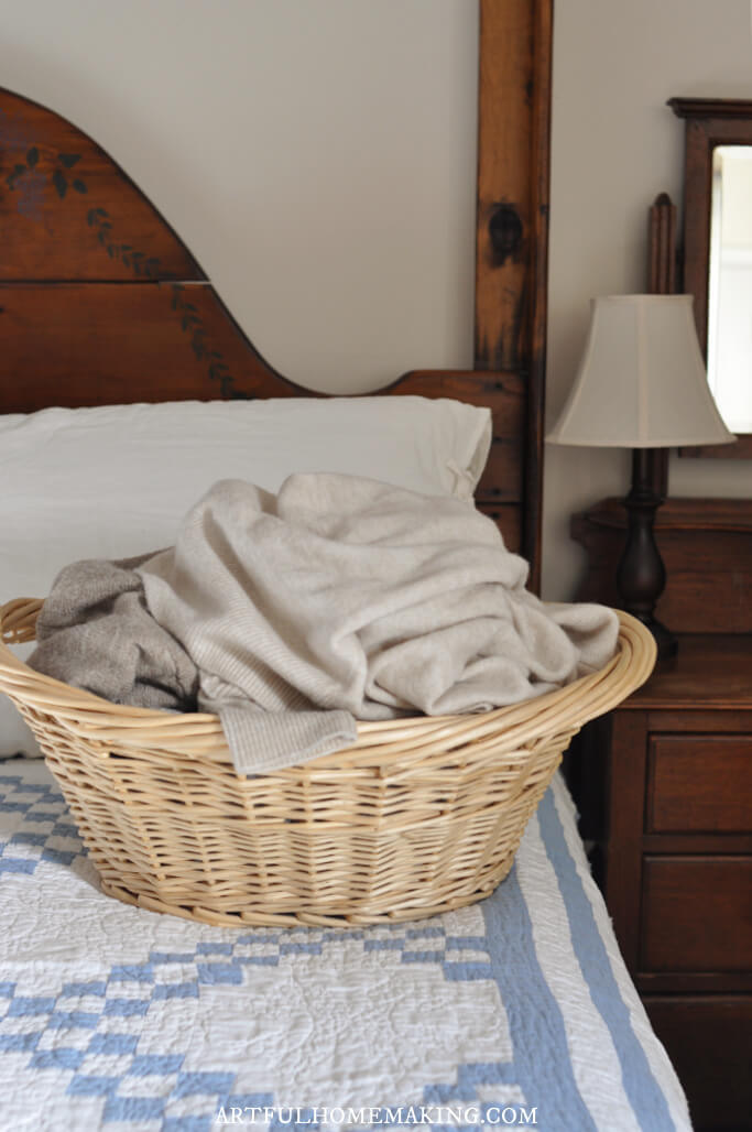 laundry in basket on bed