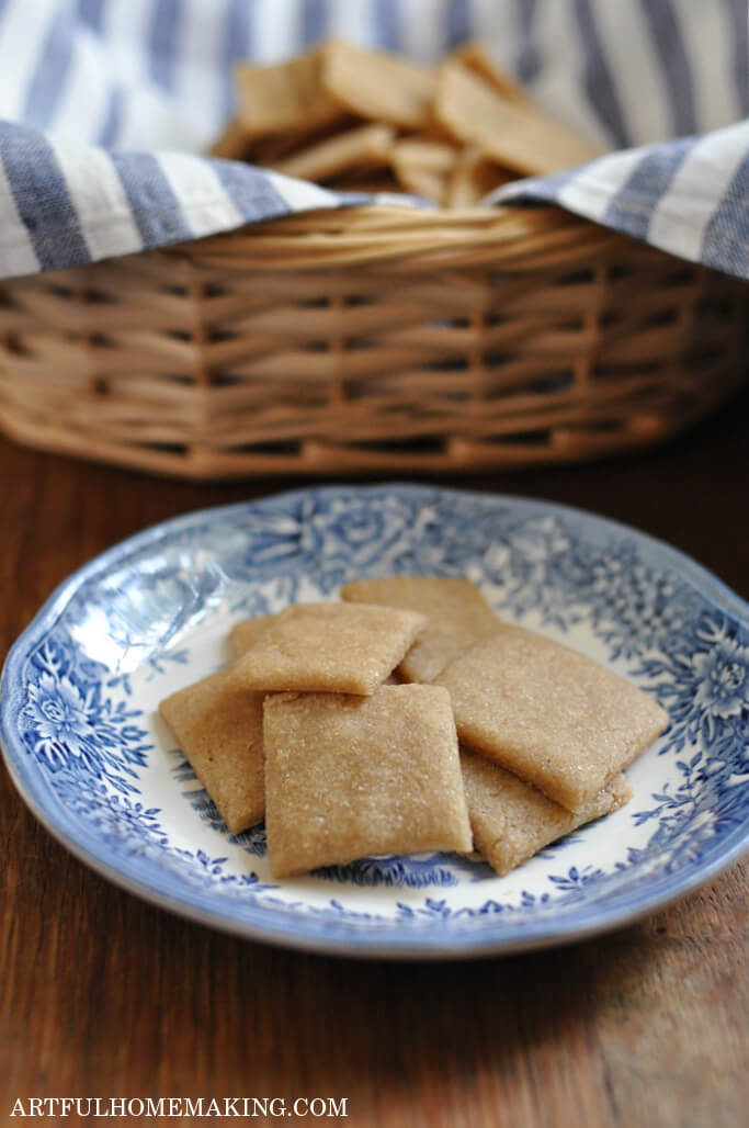 Sourdough crackers on a blue and white china plate.