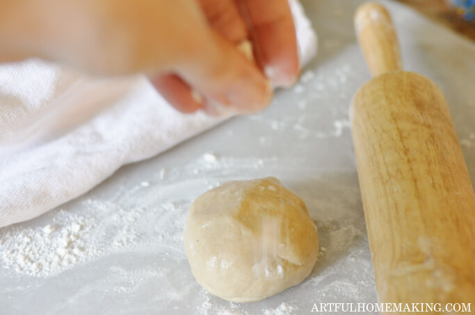 rolling out dough ball