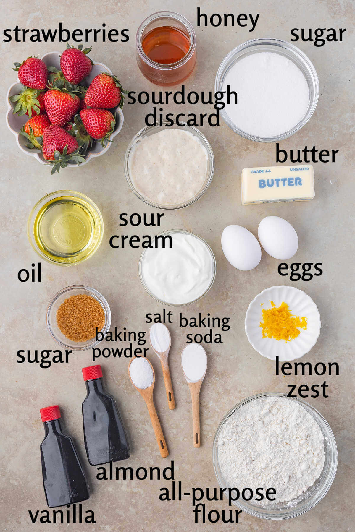 Ingredients for sourdough strawberry cake in small bowls.