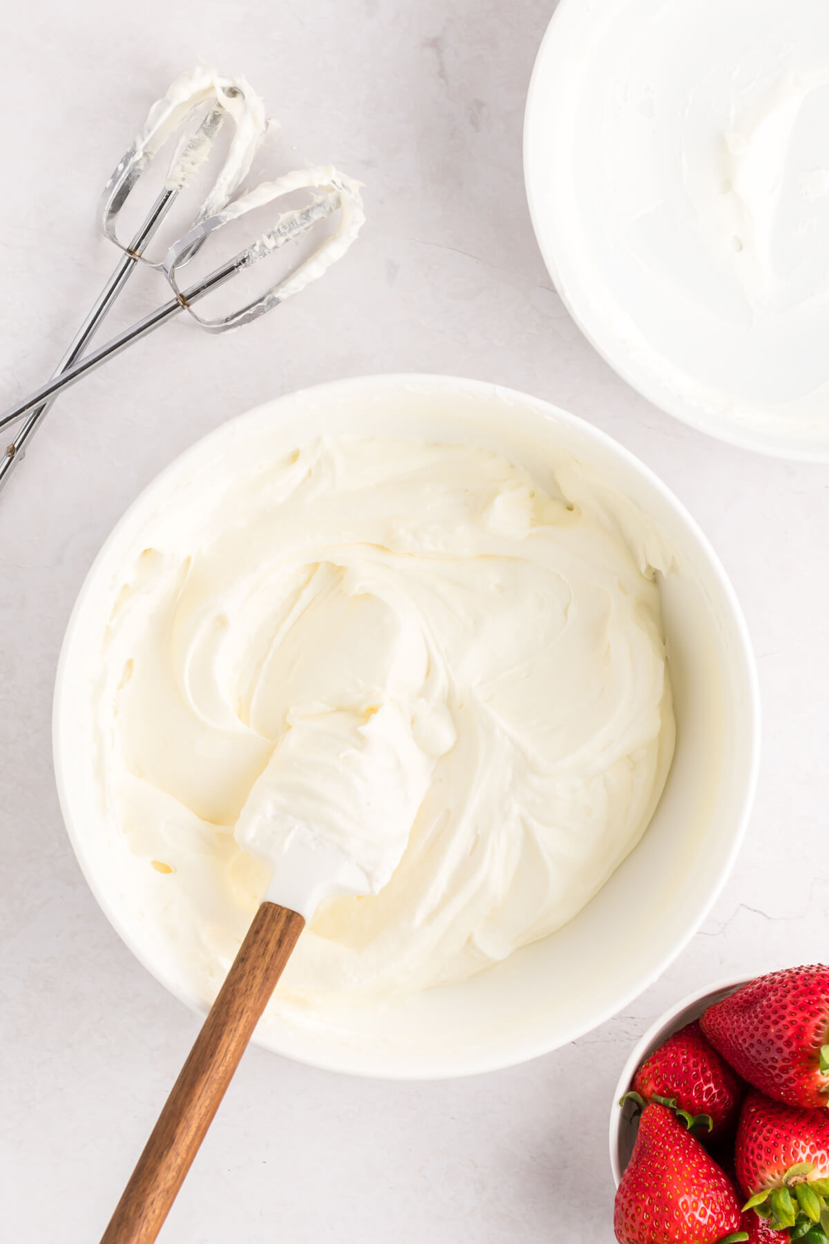 top down view of white bowl with creamy cheesecake filling